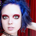 Goth chick putting on makeup black panties