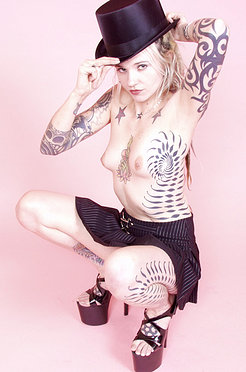 Dreadlocked tattooed goth blonde in top hat heels