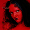 Red demon slut fucks self with devil dildo