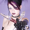 Thigh high latex slut fucks self with glass cross