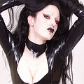 Girl in catsuit and high heels strips and spreads