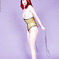 redhead in gold fetish corset and high heels