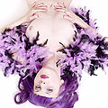 purple hair girl in striped stockings feather boa
