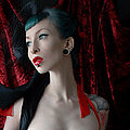 Gothic vampire deathrock babe Razor Candi in hot red ribbons and black lace